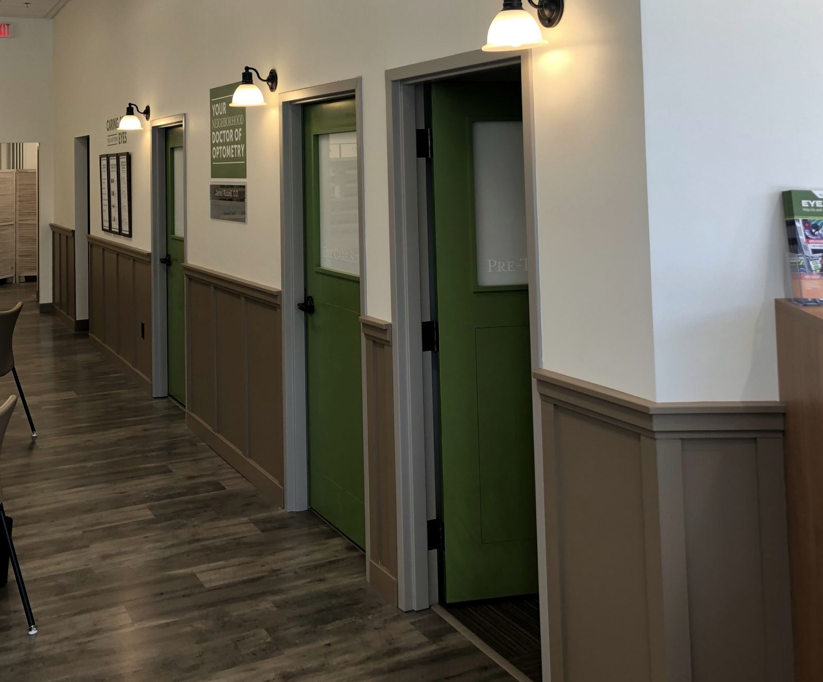 Hallway of exam room doors in an eyecare practice